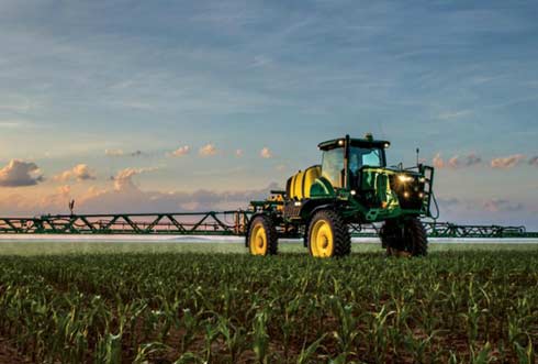Fieldwork early in the season, green tractor.