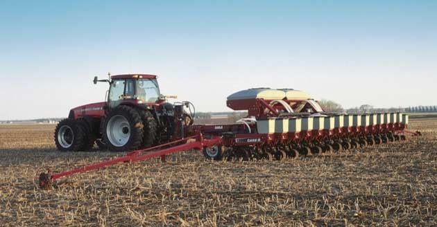 Photo - Tractor in field, spring fieldwork.